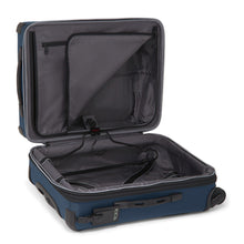 Load image into Gallery viewer, Interior view of the blue suitcase with the panel divider unzipped, showing the garment hanger. 
