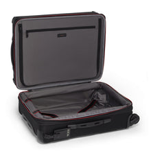 Load image into Gallery viewer, Interior view of the suitcase showing a zipper-closing panel divider and a set of adjustable straps to hold your contents. 
