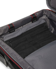 Load image into Gallery viewer, Interior view of the black suitcase showing an organizational pocket. 
