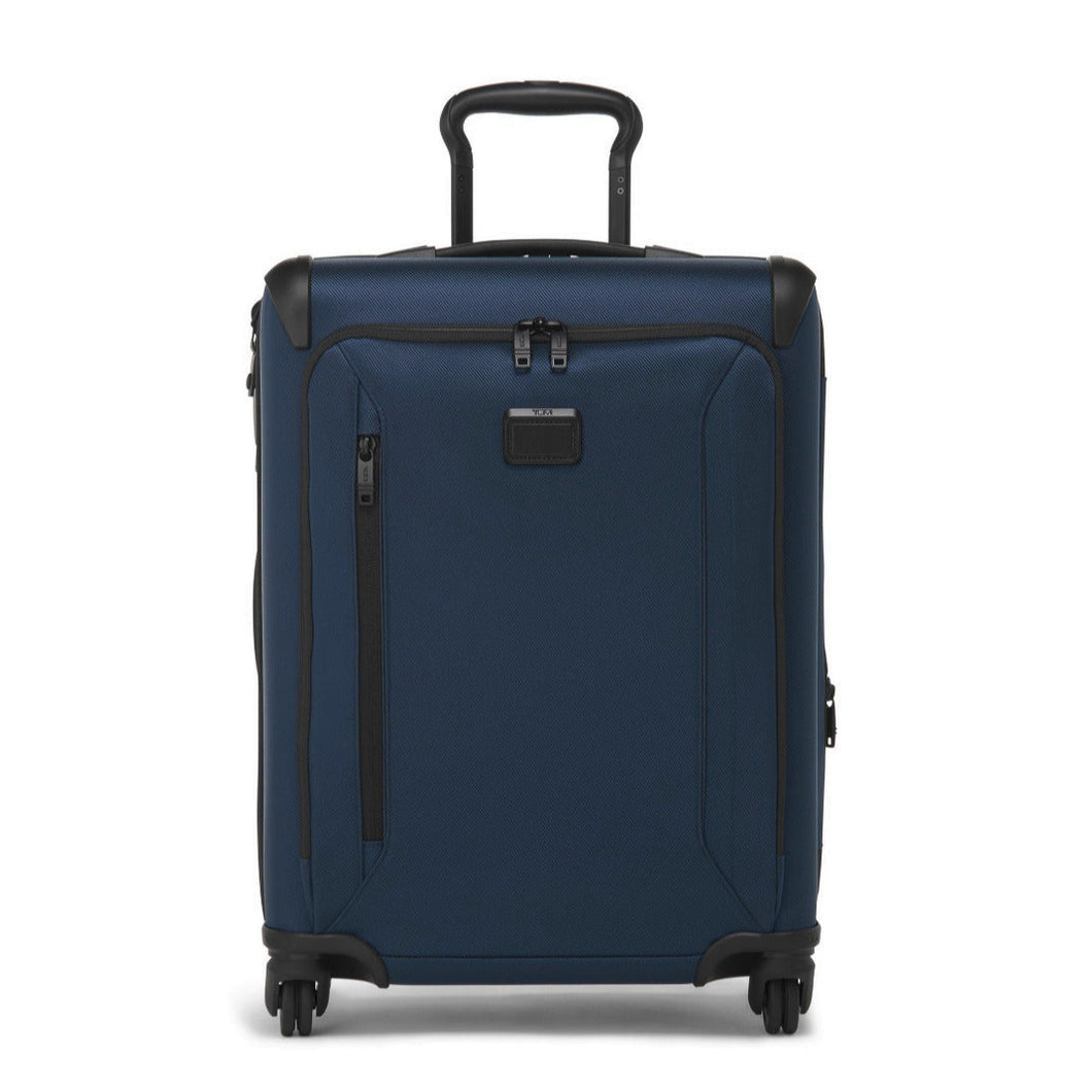 Front panel view of the blue suitcase with the telescopic handle partly extended. 