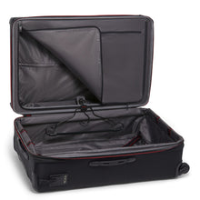 Load image into Gallery viewer, Interior view of the black suitcase showing the panel divider and garment hanger. 
