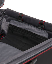 Load image into Gallery viewer, Interior view of the black suitcase showing a thin zipper-closing pocket.
