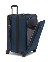 Load image into Gallery viewer, Angled front view of the blue suitcase with the front panel unzipped. 
