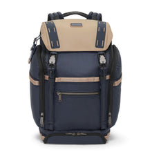 Load image into Gallery viewer, Front panel view of the blue backpack with tan accents. 
