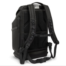 Load image into Gallery viewer, Angled back view of the backpack showing the attachment straps in the shoulder strap. 
