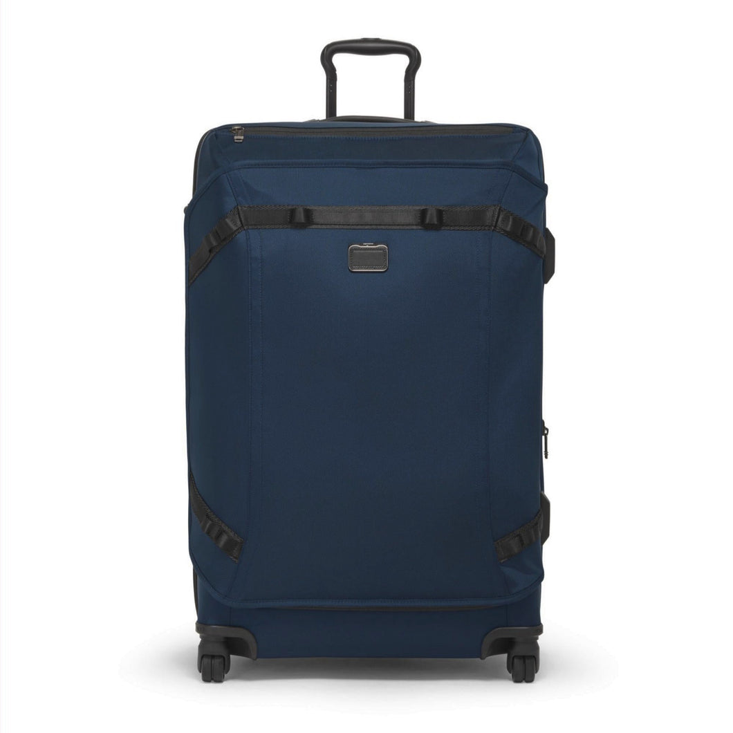 Front panel view of the soft sided blue suitcase with black accents. 