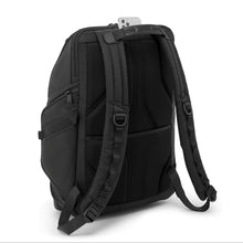 Load image into Gallery viewer, Angled back panel view of the backpack showing a padded back panel and adjustable straps. There is a phone compartment under the grab handle. 
