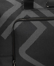 Load image into Gallery viewer, Close up to the fabric on the front panel, showing the Tumi logo in light gray.
