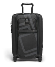 Load image into Gallery viewer, Front panel view of the black suitcase with the telescopic handle partly extended. 
