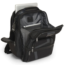 Load image into Gallery viewer, Angled front panel view of the black backpack with the main compartment unzipped. A laptop is peeking from the back panel&#39;s pocket. 
