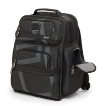Load image into Gallery viewer, Angled front view of the backpack showing the side panel&#39;s pocket unzipped. 
