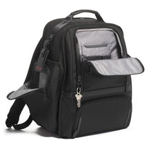 Load image into Gallery viewer, Angled front view of the black backpack with the front pocket unzipped. a key is clipped to the zipper with a key-ring. 
