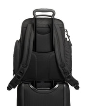 Load image into Gallery viewer, Back panel view showing the attachment feature. This allows for the telescopic handle of a suitcase to pass through and keep the backpack in place. 
