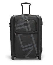 Load image into Gallery viewer, Front panel view of the suitcase with the telescopic handle extended. 
