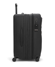 Load image into Gallery viewer, Side panel view of the suitcase with the expandable feature unzipped. 
