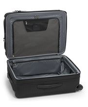 Load image into Gallery viewer, Interior view of the suitcase laid on its back. The front panel has a zipper-closing divider with compartments. 
