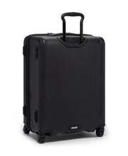 Load image into Gallery viewer, Angled back panel view of the black suitcase. The telescopic handle is partly extended. 
