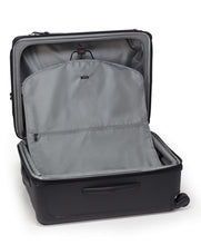Load image into Gallery viewer, Interior view of the suitcase showing the front panel&#39;s garment holder.
