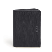 Load image into Gallery viewer, Front panel view of the wallet. A small Tumi logo is embossed on the side. 
