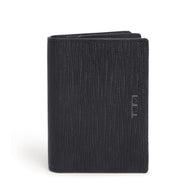 Front panel view of the wallet. A small Tumi logo is embossed on the side. 