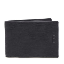 Load image into Gallery viewer, Front panel view of the black wallet. a small Tumi logo is embossed on the side. 
