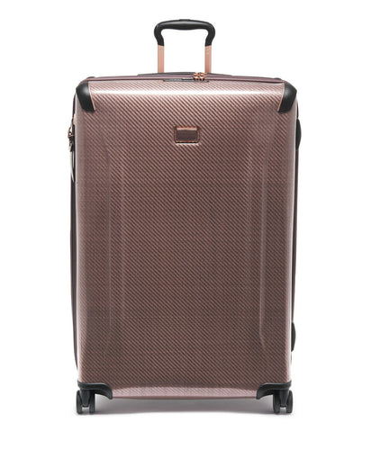 Front panel view of the blush colored suitcase. 