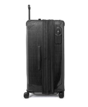 Load image into Gallery viewer, Side panel view of the black suitcase. It features a grab handle and a tag. 
