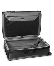 Load image into Gallery viewer, Interior view of the suitcase. The front side features a zipper-closing panel divider. The back side a set of adjustable straps to hold your contents. 
