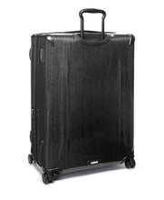 Load image into Gallery viewer, Angled back panel view of the black suitcase on a white background. 

