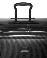 Load image into Gallery viewer, Angled close up to the top panel. It features a grab handle, and a TSA approved three-digit combination lock. 
