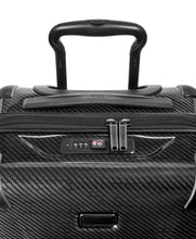 Load image into Gallery viewer, Close up to the top panel of the suitcase. It features a grab handle, and a TSA approved three-digit combination lock. 

