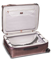 Load image into Gallery viewer, Interior view of the suitcase. The lining is light gray. The front side has a zipper-closing panel divider. The back side has a set of adjustable straps to hold contents in place. 
