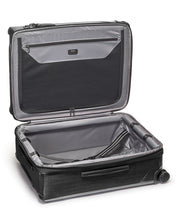 Load image into Gallery viewer, Interior view of the suitcase. The front side features a zipper-closing panel divider, and the back a set of straps to hold your contents. 
