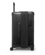 Load image into Gallery viewer, Side panel view of the suitcase with the expandable feature unzipped. It features a grab handle and a tag.
