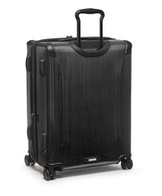 Load image into Gallery viewer, Angled back panel view of the suitcase with the telescopic handle partly extended. 
