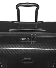 Load image into Gallery viewer, Angled close up to the suitcase&#39;s top panel. It features a grab handle, and a TSA approved three-digit combo lock. 

