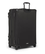 Load image into Gallery viewer, Angled back panel view of the suitcase. 
