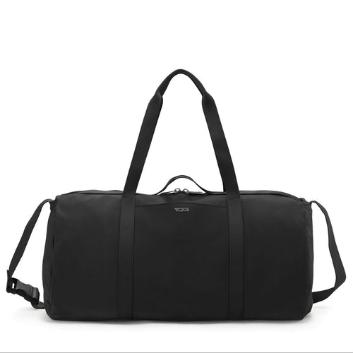 Front panel view of the duffle bag featuring an adjustable shoulder strap and grab handles. 