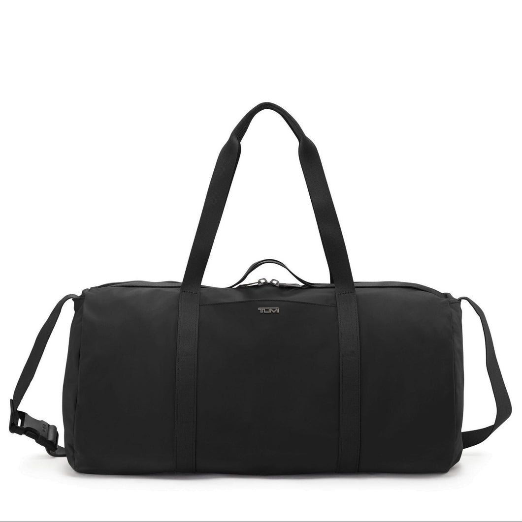 Front panel view of the duffle bag featuring an adjustable shoulder strap and grab handles. 