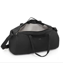 Load image into Gallery viewer, Angled top view of the duffle bag with the main compartment unzipped. 
