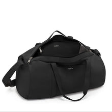 Load image into Gallery viewer, Angled top view of the suitcase with the main compartment unzipped. 
