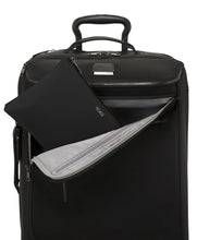 Load image into Gallery viewer, The duffle bag when folded and placed inside its zip-closing bag. It can fit on the front pocket of a suitcase.
