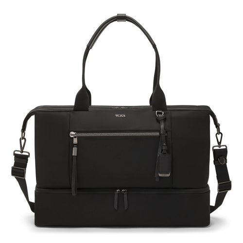 Front panel view of the black bag,  featuring detachable shoulder straps, a main zip compartment, and zipper-closing pockets.