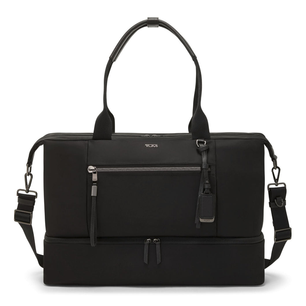 Front panel view of the black bag,  featuring detachable shoulder straps, a main zip compartment, and zipper-closing pockets.
