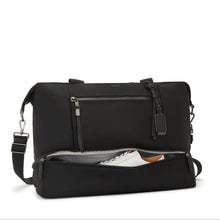 Load image into Gallery viewer, Front panel view showing the bottom zipper compartment opened with a pair of shoes inside. 
