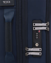 Load image into Gallery viewer, Close up to the side panel featuring a grab handle and the TSA approved three-digit combination lock. 
