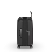 Load image into Gallery viewer, Side panel view of the hard shell suitcase showing the expandable feature unzipped. It features a grab handle, a TSA approved 3-digit combination lock.
