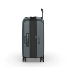 Load image into Gallery viewer, Side panel view of the suitcase with the expandable feature unzipped. It also features a grab-handle and a TSA approved three-digit combination lock. 
