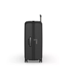 Load image into Gallery viewer, Side panel view of the black hard shell suitcase. It features a grab handle, and a TSA approved 3-digit combination lock. 
