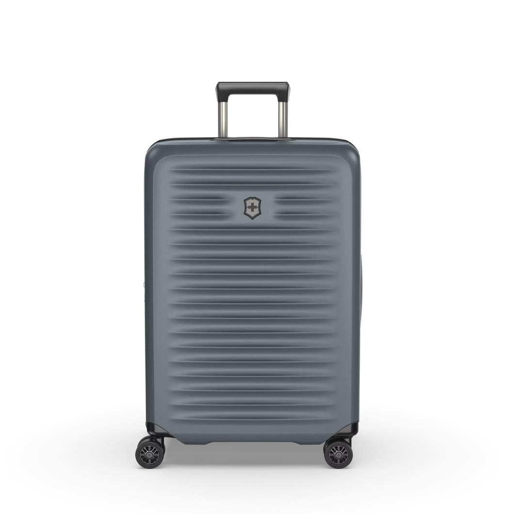 Front panel view of the hard shell suitcase with the telescopic handle partly extended. 